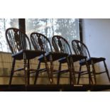 A set of Windsor style single dining chairs.