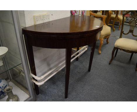 A mahogany demi-lune fold-over card table.