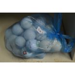 A quantity of golf balls.