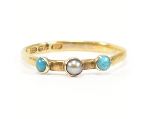 A hallmarked gold on silver, turquoise and pearl ring. The ring having a central grey bezel set pearl flanked by two turquois