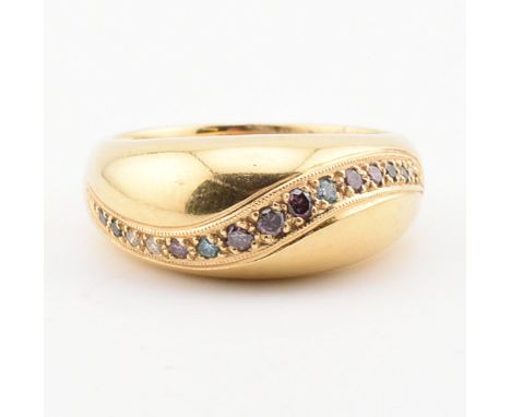 A hallmarked 18ct gold gem set bombe ring. The ring set with multiple gems including ruby, sapphire and diamonds. Weight 8.4g