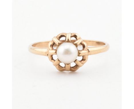 A hallmarked 9ct gold and pearl ring. The ring set with a cultured pearl in an openwork setting to plain band. Weight 1.7g. S