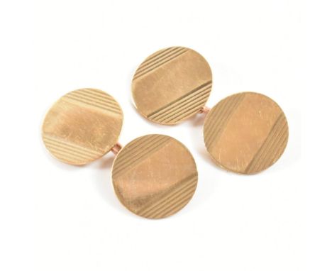 A pair of vintage hallmarked 9ct yellow gold cufflinks. The chain style cufflinks having circular heads and tails with engine