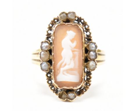 A 19th century gold cameo and pearl ring. The ring set with a cameo plaque having pearl accents and reeded tapering shank. Un