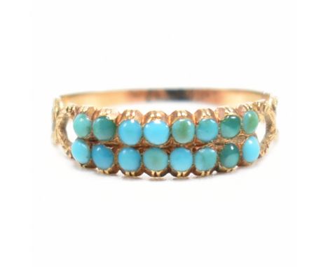A Georgian gold and turquoise ring. The ring having two rows of turquoise cabochons having foliate shoulders to ribbed shank.