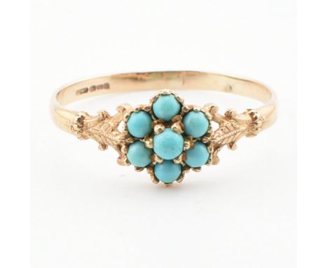 A hallmarked 9ct gold and turquoise cluster ring. The ring having a cluster of round turquoise cabochons to acanthus leaf sho