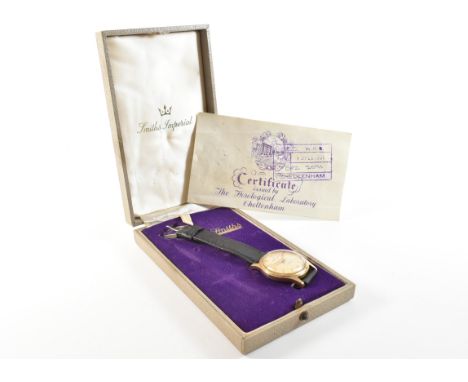 A vintage 9ct yellow gold Smiths Imperial wristwatch. The watch having a circular champagne coloured dial with gold tone pitc