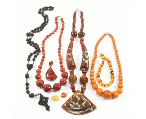 An assorted collection of costume jewellery. The lot to include amber, horn, bog oak, beads, simulated amber, plastic, neckla