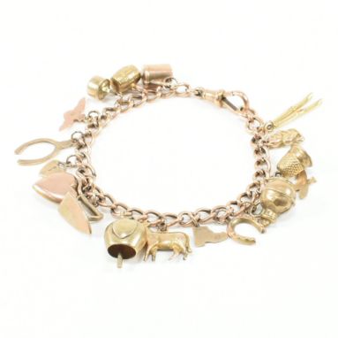 A 9ct gold charm bracelet with yellow metal and gold charms. The curb link bracelet united by dog lead clasp each link being 
