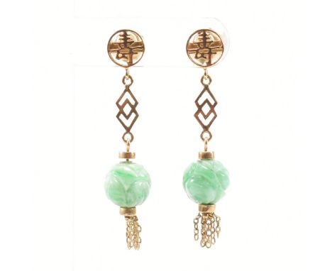 A pair of vintage 14ct yellow gold and jade drop earrings. The earrings having straight post backs to a circular head with pi