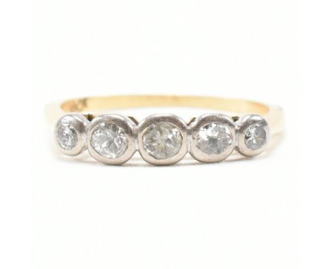 A vintage 18ct yellow gold and diamond five stone ring. The ring having five round cut graduating bezel set diamonds to a che