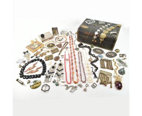 An assorted collection of antique and later costume jewellery. The lot to include gold and silver tone metal, chains, necklac