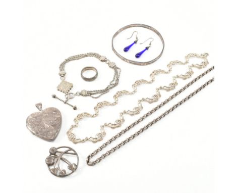 An assorted collection of silver jewellery. The lot to include an etched scrolling pattern hear locket necklace pendant, hall