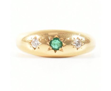 A vintage hallmarked 18ct yellow gold, emerald and diamond dome ring. The gypsy style ring having a central round cut star se