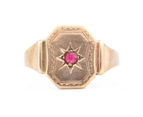 A vintage 9ct gold and ruby signet ring. The ring having synthetic ruby in a star set mount to the head. Partial hallmark to 