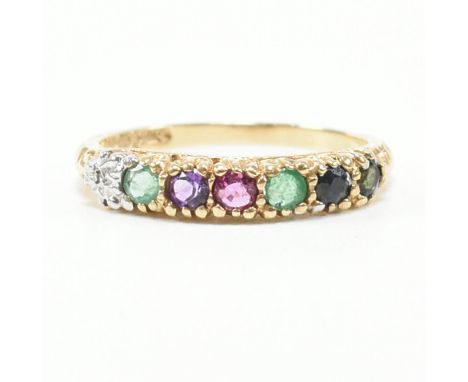 A hallmarked 9ct gold and gem set Dearest ring. The ring set with diamond emerald amethyst ruby and sapphire having scrolled 