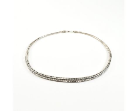 A vintage 925 silver chain necklace. The graduating tubular snake style chain having wirework and braided finials and united 