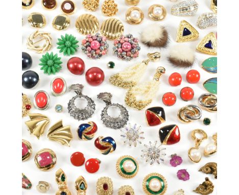 An assorted collection of vintage and later earrings. The lot to include gold and silver tone metal, gold plating, simulated 