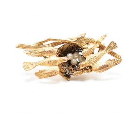 A 19th century Victorian birds on a nest brooch. The brooch featuring doves surrounding nest having pearl eggs centre. Pin ve
