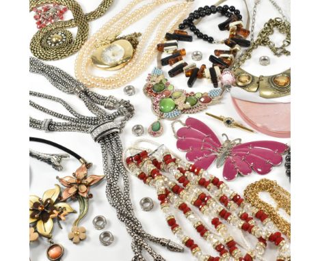 An assorted collection of costume jewellery. The lot to include gold and silver tone metal, necklaces, rings, watches, earrin