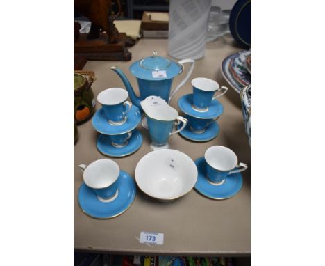 A George V Royal Worcester bone china coffee set, comprising coffee pot, six cups, six saucers, sugar and cream each with an 