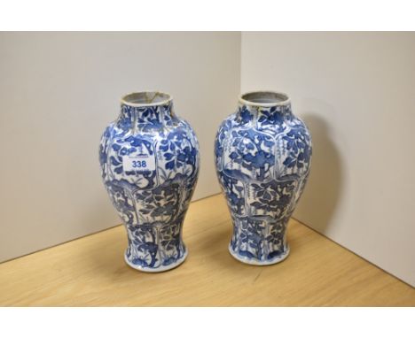 A pair of 19th Century Chinese blue and white vases, of baluster form with hand painted decoration depicting fruiting vines w