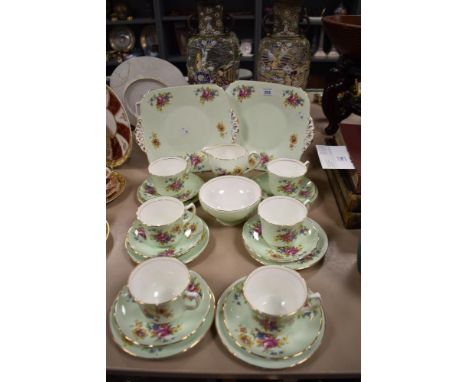 A 1950s H-O &amp; Co. tea set in mint green with gold coloured trim, comprising sandwich plates, tea cups and saucers, cream 