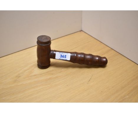 A 20th Century hardwood gavel with turned grip and measuring 18cm long