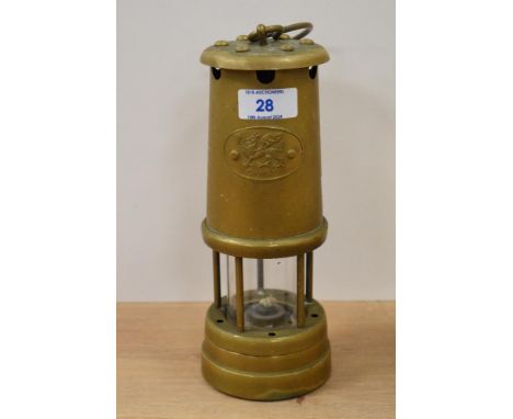 A vintage brass Cymru (Wales) miner's lamp, measuring 23cm high