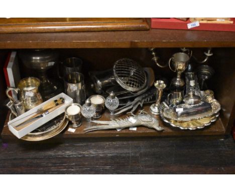 A selection of silver plated ware, to include two white metal pheasant studies, scalloped dishes, tankards, and Aladdin oil l