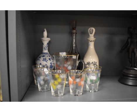 A mid-20th Century hand painted glass lemonade set, and three decanters, to include a Bohemian style ruby and etched glass de