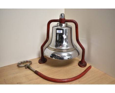 A vintage chromed brass Fire Engine or station bell with red painted mounting bracket, 36cm sold along with a metal attachmen