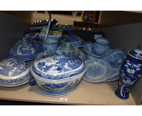 A Chinese blue and white pottery baluster vase and cover, cracked ice and prunus pattern with foo dog finial to over and doub