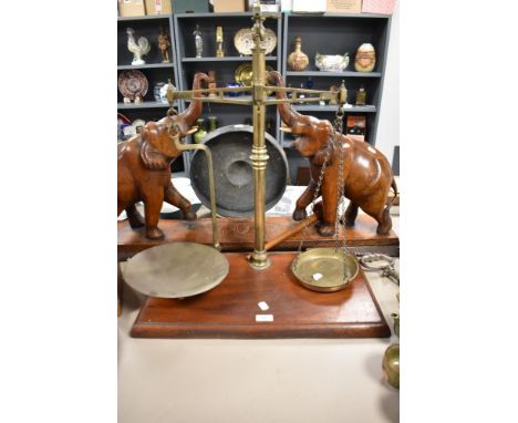 A set of Victorian beam balance apothecary scales, inscribed for T.M Smirk of Newcastle, raised upon a moulded mahogany, rect