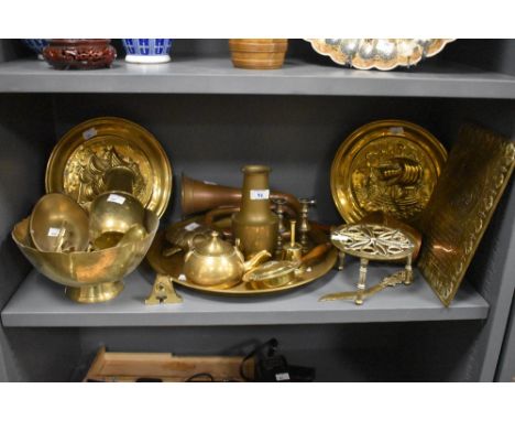 A selection of vintage brass and copperware, to include nautical themed embossed plates, a 'Bless This House' brass plaque, a