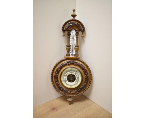 A Victorian walnut aneroid wheel barometer, measuring 40cm high