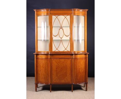 A Fine Edwardian Satinwood Display Cabinet inlaid with ebony stringing and having kingwood cross-banded borders. The glazed u