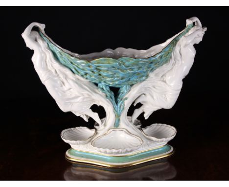 A Copeland Porcelain Centre Piece modelled as a boat-form bowl of turquoise glazed seaweed raised on a clump of coral between
