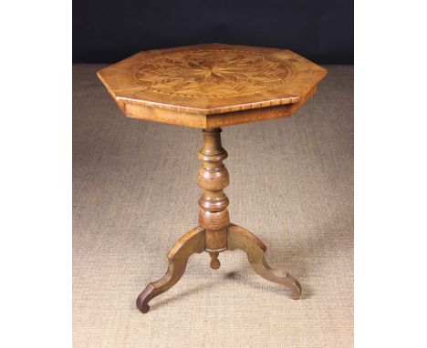 A 19th Century Italian Marquetry Tripod Table.  The octagonal top inlaid with a petalled and banded geometric radial display 