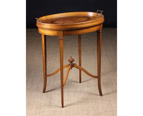 A Fine Quality Inlaid Satinwood Tray-topped Table.  The oval top having a detachable glass tray with scroll handles, protecti