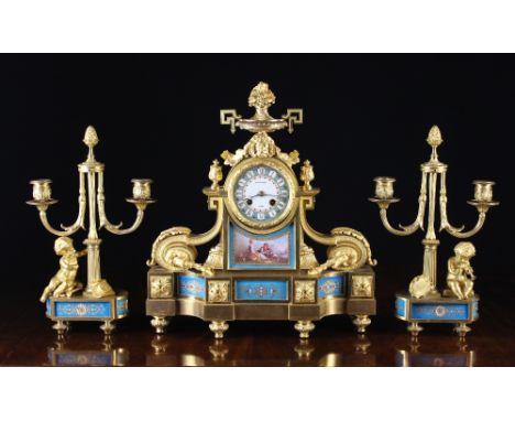 A Fine 19th Century Ormolu Mounted Sèvres Clock Set by Raingo  Frères Paris, in the Louis XVI Style. The clock surmounted by 