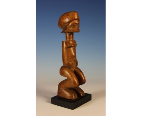 A Rare Lunda Female Figure from the area of Angola and The Congo Basin, 11 ins (28 cms) high.