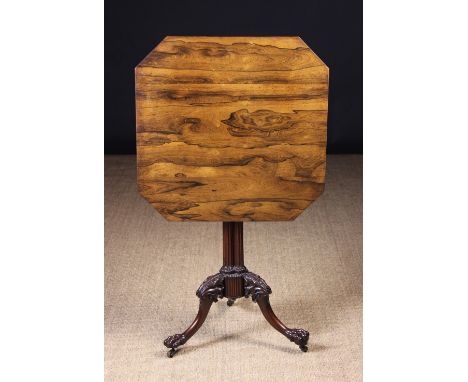 A Fine Quality 19th Century Tilt-top Tripod Table. The rosewood near square top with canted corners above a carved mahogany b