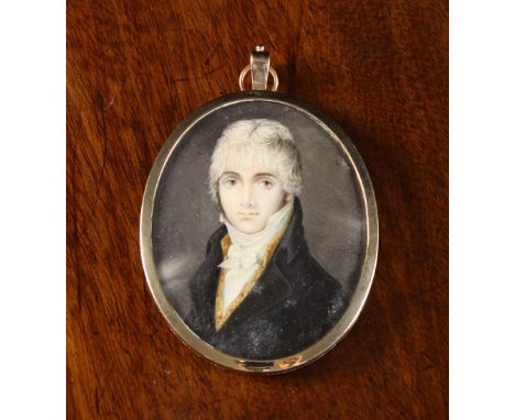 A 19th Century Signed Miniature Portrait of a Young Regency Gentleman in a pendant gilt frame, 2½ ins x 2 ins (6.5 cms x 5 cm
