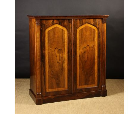 A Fine Quality 19th Century Rosewood Veneered Collector's Cabinet. The twin doors having lancet arch topped panels of reflect