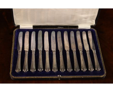 A Set of Twelve Silver Handled Butter Knives hallmarked Sheffield 1918-19 with John Biggin (subsequently John Biggin Ltd) mak