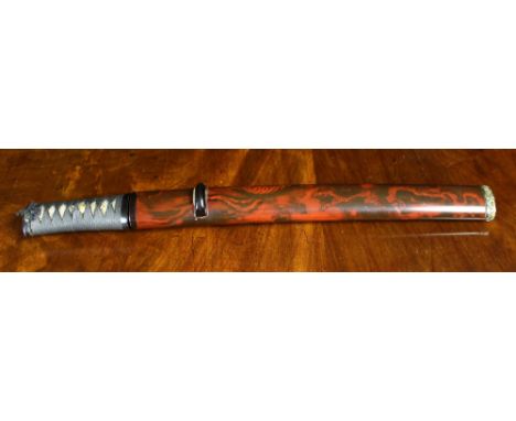 A Japanese Tanto Dagger in a lacquered sheath.  The fine 9 ins (23 cms) blade possibly 15th century with copper habaki and a 