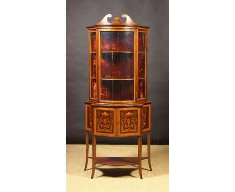 A Fine Inlaid Mahogany Serpentine Front Display Cabinet with enamelled maker's label: James Shoolbred & Co. Tottenham House, 