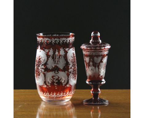 Two Pieces of Bohemian Ruby Flashed Glass: A miniature pedestal vase & cover engraved with turreted buildings and scrolling c