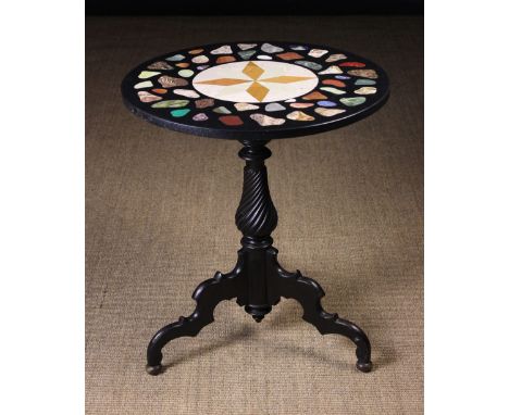 A Specimen Marble Topped Tripod Table. The round top inlaid with a compass star to the centre and irregular stone specimens o